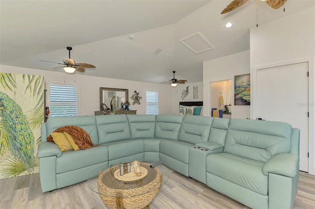 living room featuring vaulted ceiling, wood finished floors, and ceiling fan