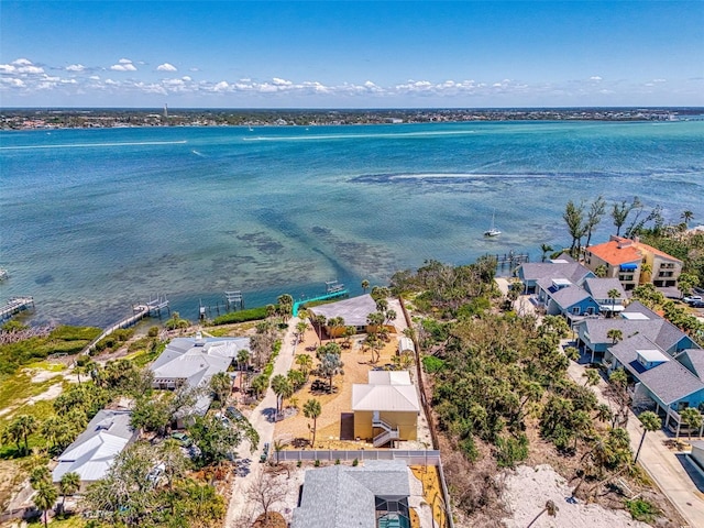 drone / aerial view featuring a water view and a residential view