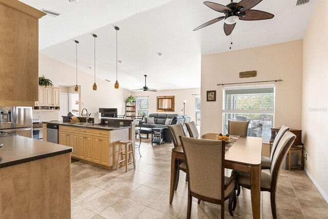7089 Benson St, Englewood, FL 34224 - dining space with light tile patterned floors, visible vents, high vaulted ceiling, and ceiling fan