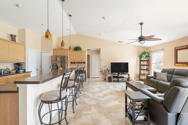 7089 Benson St, Englewood, FL 34224 - living room with high vaulted ceiling, a ceiling fan, and visible vents
