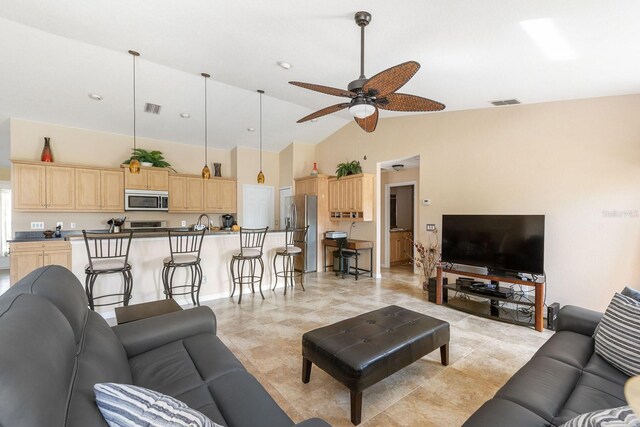7089 Benson St, Englewood, FL 34224 - living room with visible vents, a ceiling fan, and high vaulted ceiling