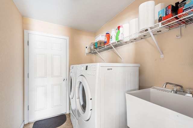 7089 Benson St, Englewood, FL 34224 - laundry area featuring separate washer and dryer, a sink, and laundry area