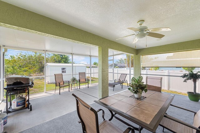 7089 Benson St, Englewood, FL 34224 - sunroom with a textured ceiling, outdoor dining space, and ceiling fan