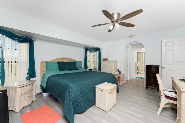 23347 Lehigh Ave, Port Charlotte, FL 33954 - bedroom featuring arched walkways, wood finished floors, visible vents, and a ceiling fan