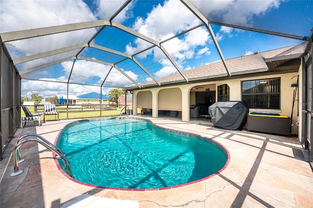 23347 Lehigh Ave, Port Charlotte, FL 33954 - pool with glass enclosure, a grill, and a patio