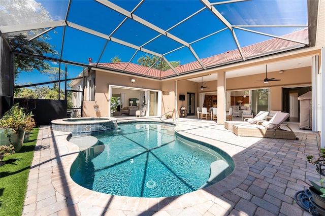 26 Saint Croix Way, Englewood, FL 34223 - view of swimming pool featuring a ceiling fan, a patio, an outdoor living space, a lanai, and a pool with connected hot tub