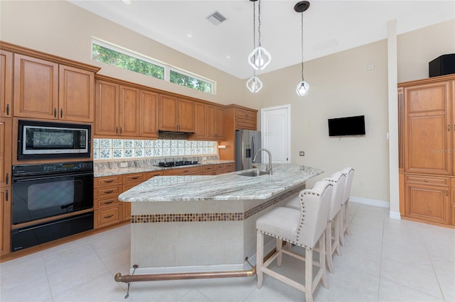 26 Saint Croix Way, Englewood, FL 34223 - kitchen featuring built in microwave, oven, a warming drawer, gas stovetop, and stainless steel refrigerator with ice dispenser
