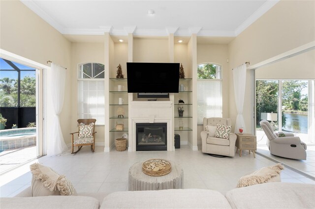 26 Saint Croix Way, Englewood, FL 34223 - tiled living room with ornamental molding and a glass covered fireplace