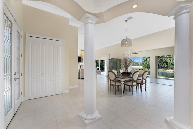 26 Saint Croix Way, Englewood, FL 34223 - dining room featuring decorative columns, a towering ceiling, and light tile patterned floors