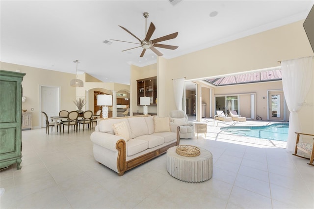 26 Saint Croix Way, Englewood, FL 34223 - living room with light tile patterned floors, a towering ceiling, and ceiling fan