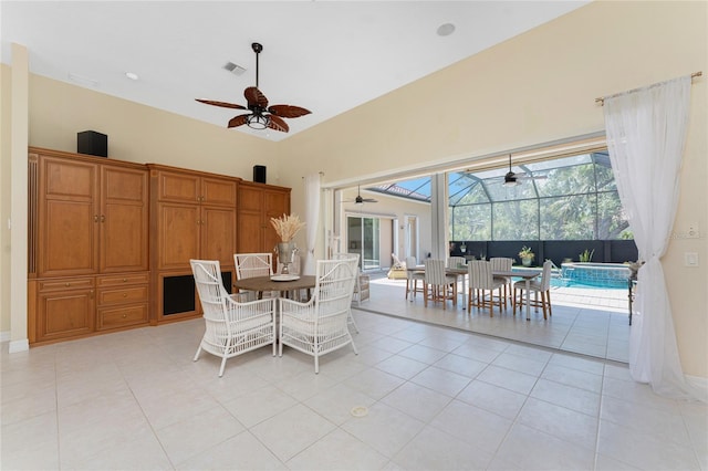 26 Saint Croix Way, Englewood, FL 34223 - dining space with visible vents, light tile patterned floors, baseboards, a sunroom, and ceiling fan