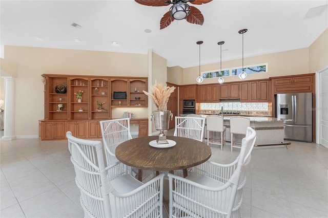 26 Saint Croix Way, Englewood, FL 34223 - dining room with visible vents, a high ceiling, ceiling fan, and light tile patterned flooring