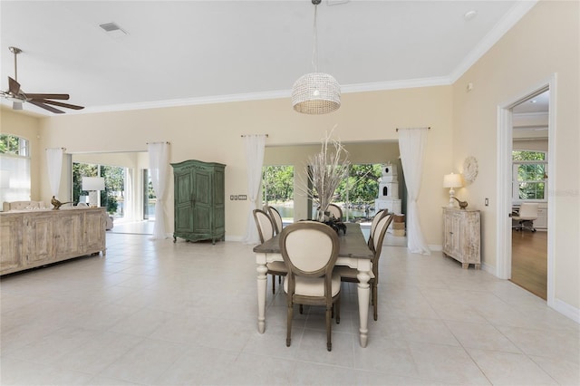 26 Saint Croix Way, Englewood, FL 34223 - dining area featuring light tile patterned flooring, visible vents, ornamental molding, and ceiling fan