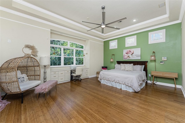 26 Saint Croix Way, Englewood, FL 34223 - bedroom featuring crown molding, wood finished floors, a tray ceiling, baseboards, and recessed lighting