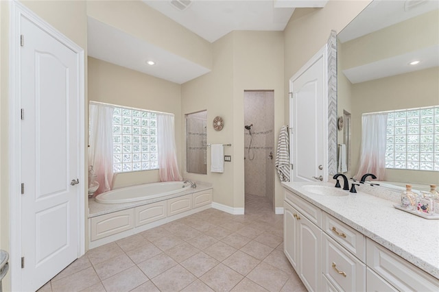 26 Saint Croix Way, Englewood, FL 34223 - bathroom with tile patterned floors, a bath, vanity, walk in shower, and baseboards