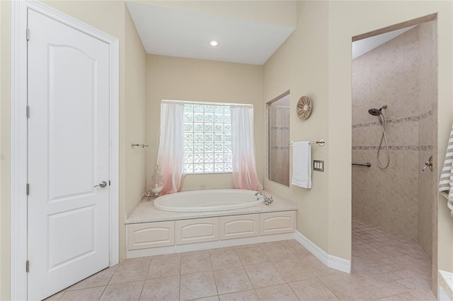 26 Saint Croix Way, Englewood, FL 34223 - bathroom featuring a bath, walk in shower, tile patterned flooring, and baseboards