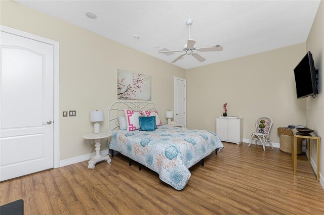 26 Saint Croix Way, Englewood, FL 34223 - bedroom featuring baseboards, wood finished floors, and ceiling fan