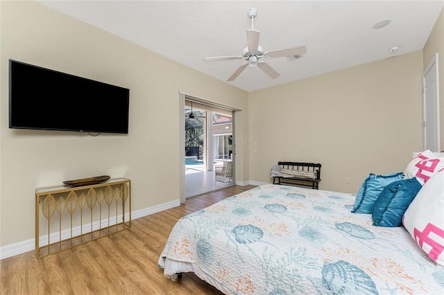 26 Saint Croix Way, Englewood, FL 34223 - bedroom with access to exterior, visible vents, baseboards, a ceiling fan, and wood finished floors