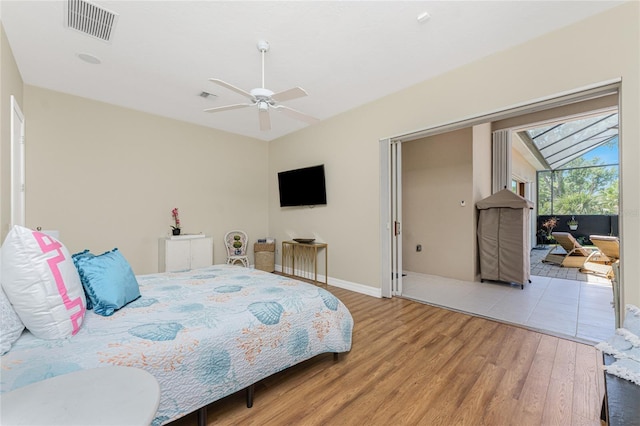 26 Saint Croix Way, Englewood, FL 34223 - bedroom featuring light wood-type flooring, visible vents, a ceiling fan, and baseboards