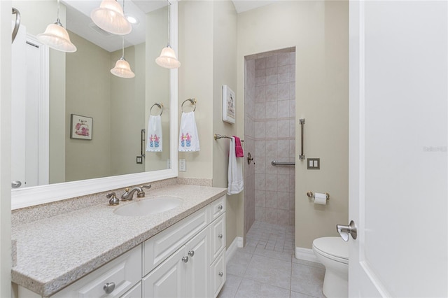 26 Saint Croix Way, Englewood, FL 34223 - full bath with tiled shower, toilet, baseboards, tile patterned flooring, and vanity