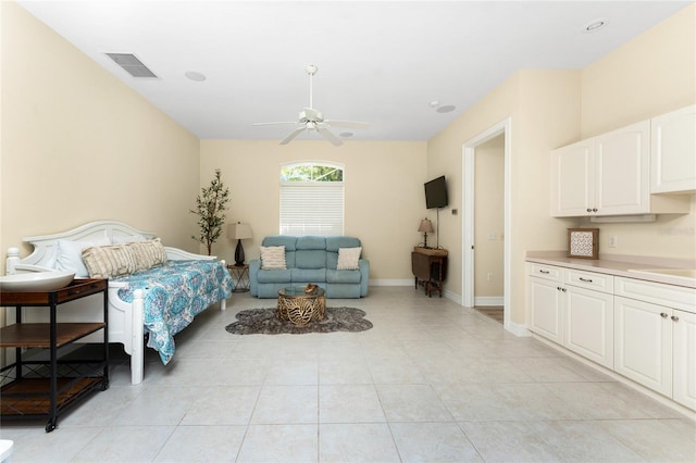 26 Saint Croix Way, Englewood, FL 34223 - bedroom with a sink, baseboards, visible vents, a ceiling fan, and light tile patterned floors