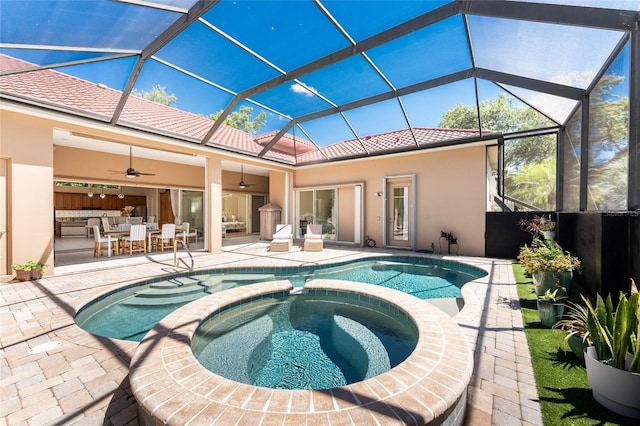 26 Saint Croix Way, Englewood, FL 34223 - view of swimming pool with a pool with connected hot tub, a patio area, glass enclosure, and ceiling fan