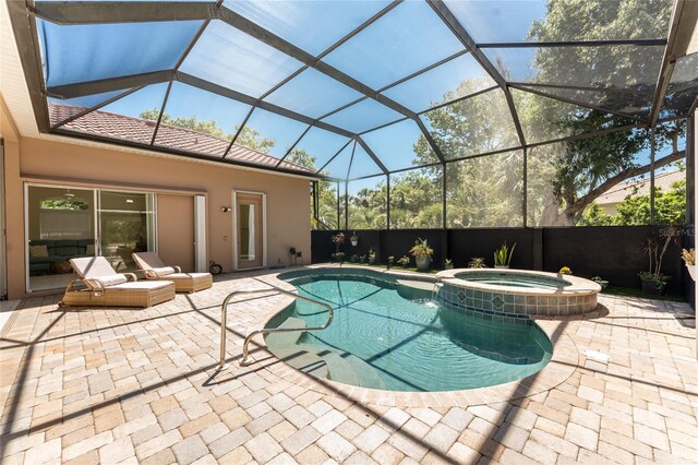 26 Saint Croix Way, Englewood, FL 34223 - view of swimming pool featuring a lanai, a patio area, and a pool with connected hot tub