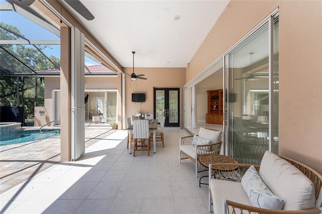 26 Saint Croix Way, Englewood, FL 34223 - view of patio / terrace featuring glass enclosure, french doors, a ceiling fan, a pool with connected hot tub, and an outdoor living space