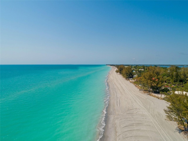 bird's eye view featuring a beach view and a water view