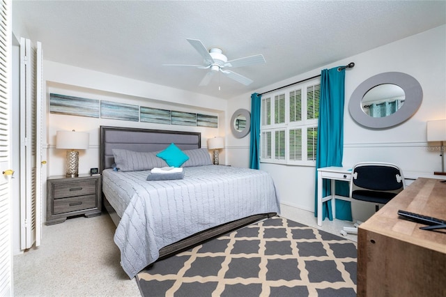 bedroom featuring a textured ceiling, ceiling fan, and speckled floor