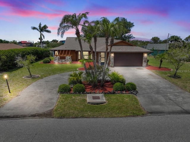 6305 Shalimar St, Port Charlotte, FL 33981 - ranch-style home featuring concrete driveway, an attached garage, and a lawn
