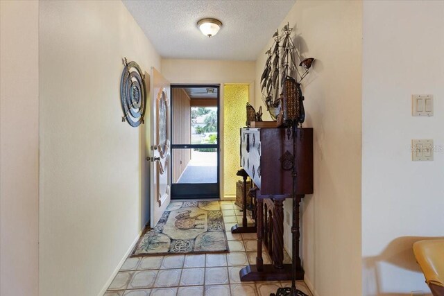 6305 Shalimar St, Port Charlotte, FL 33981 - entryway with a textured ceiling and light tile patterned floors
