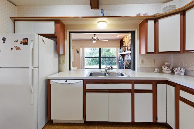 6305 Shalimar St, Port Charlotte, FL 33981 - kitchen featuring white appliances, wallpapered walls, light countertops, white cabinets, and a ceiling fan