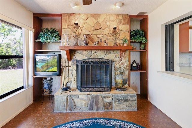 6305 Shalimar St, Port Charlotte, FL 33981 - living area with baseboards and a stone fireplace