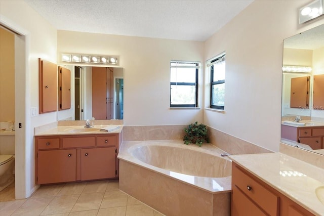 6305 Shalimar St, Port Charlotte, FL 33981 - full bathroom with a bath, two vanities, and tile patterned flooring
