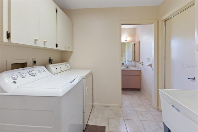 6305 Shalimar St, Port Charlotte, FL 33981 - laundry room featuring cabinet space, washing machine and clothes dryer, and light tile patterned flooring