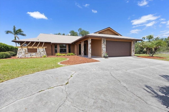 6305 Shalimar St, Port Charlotte, FL 33981 - ranch-style home featuring stone siding, a garage, driveway, and a front lawn