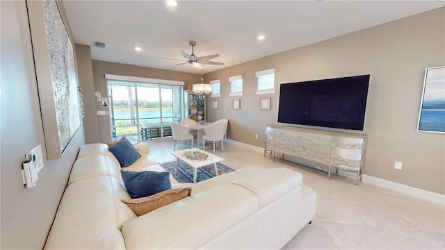 living area with visible vents, baseboards, light tile patterned floors, a ceiling fan, and recessed lighting