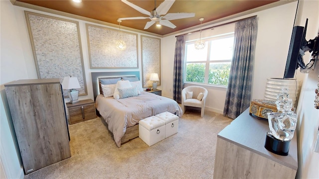 bedroom with crown molding, ceiling fan, baseboards, and light carpet