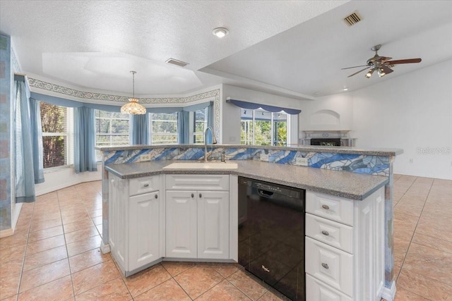 kitchen featuring dishwasher, a sink, visible vents, and light tile patterned floors
