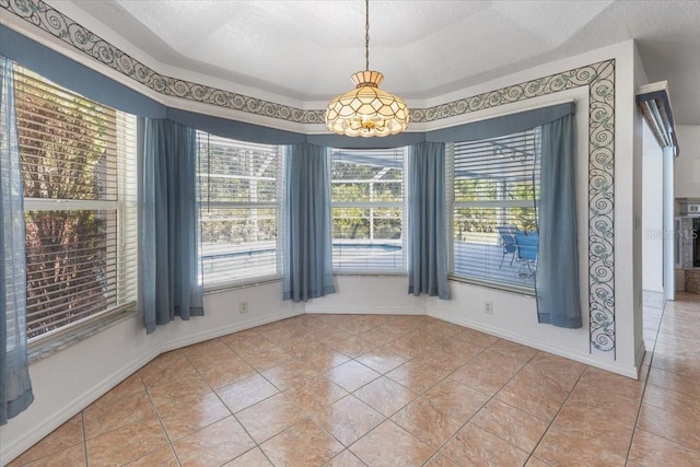 unfurnished dining area featuring baseboards, a wealth of natural light, and light tile patterned floors