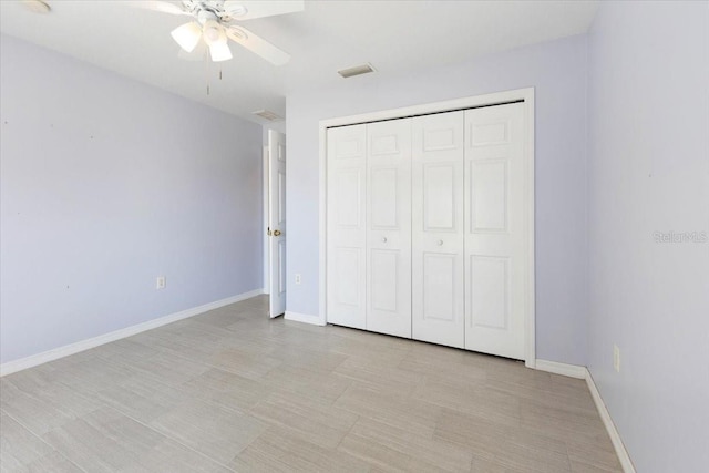 unfurnished bedroom featuring a closet, visible vents, and baseboards