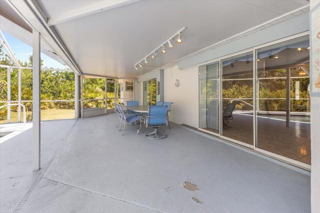 unfurnished sunroom with outdoor dining area