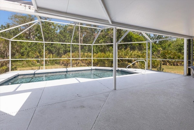 outdoor pool featuring a lanai and a patio