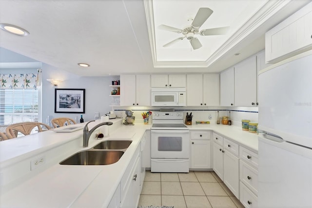 7554 Palm Island Dr S Unit 1822, Placida, FL 33946 - kitchen featuring light tile patterned floors, a sink, white cabinetry, white appliances, and light countertops