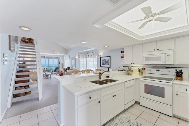 7554 Palm Island Dr S Unit 1822, Placida, FL 33946 - kitchen with a peninsula, a ceiling fan, a sink, and white appliances