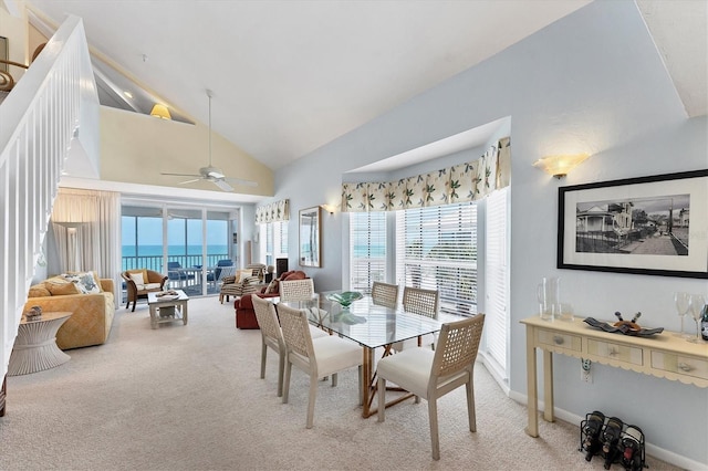 7554 Palm Island Dr S Unit 1822, Placida, FL 33946 - dining room with high vaulted ceiling, light colored carpet, baseboards, and a ceiling fan