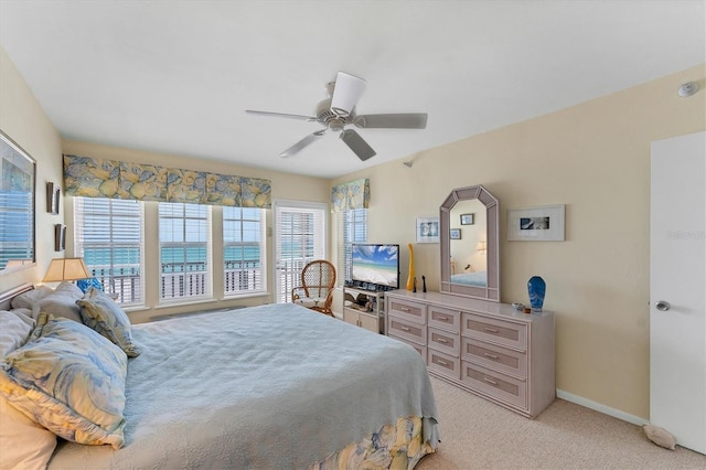 7554 Palm Island Dr S Unit 1822, Placida, FL 33946 - bedroom featuring light colored carpet, baseboards, and a ceiling fan