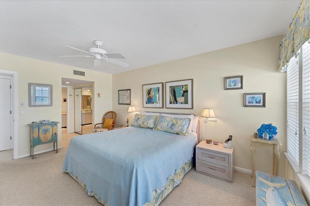 7554 Palm Island Dr S Unit 1822, Placida, FL 33946 - bedroom with visible vents, light carpet, a ceiling fan, connected bathroom, and baseboards
