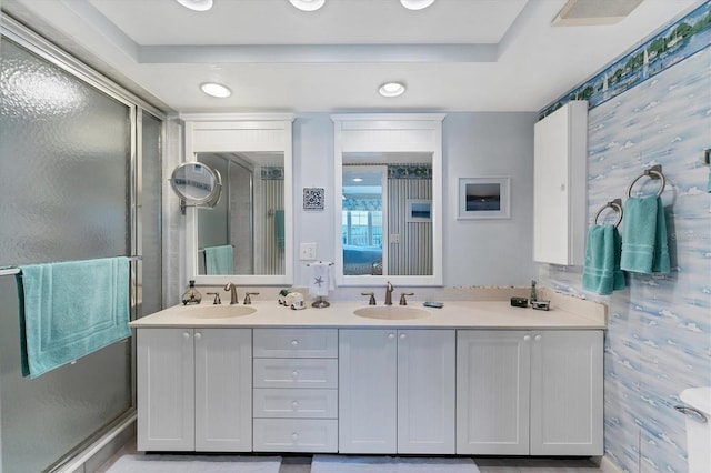 7554 Palm Island Dr S Unit 1822, Placida, FL 33946 - ensuite bathroom featuring a sink, double vanity, and a shower with door